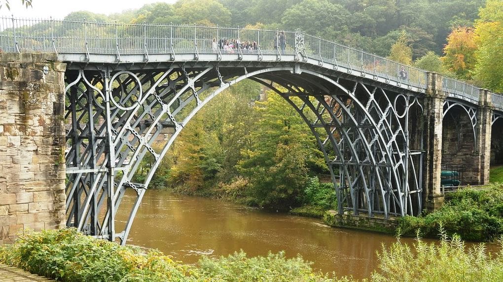 THE Ironbridge - the cast-iron bridge built over the Severn River in 1779 that helped kickoff the Industrial Revolution Built by an iron master who was a carpenter - hence mortar & tenon joints. No two spans the same. The cast-iron structure was built first and the brick pillars and road work added later. 